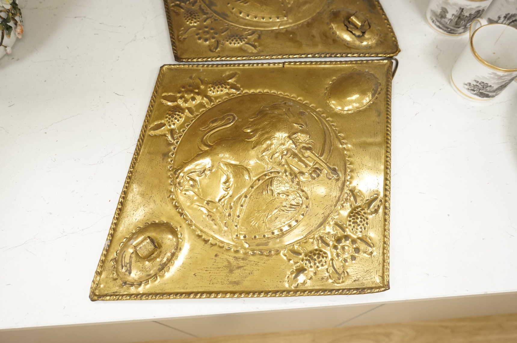 A Victorian glass spirit barrel, converted to a lamp base, together with a pair of embossed sheet-brass heraldic plaques and a replica coin set box